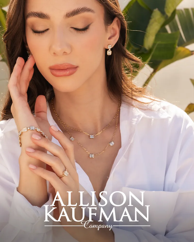 Model wearing Allison Kaufman gold and diamond jewelry