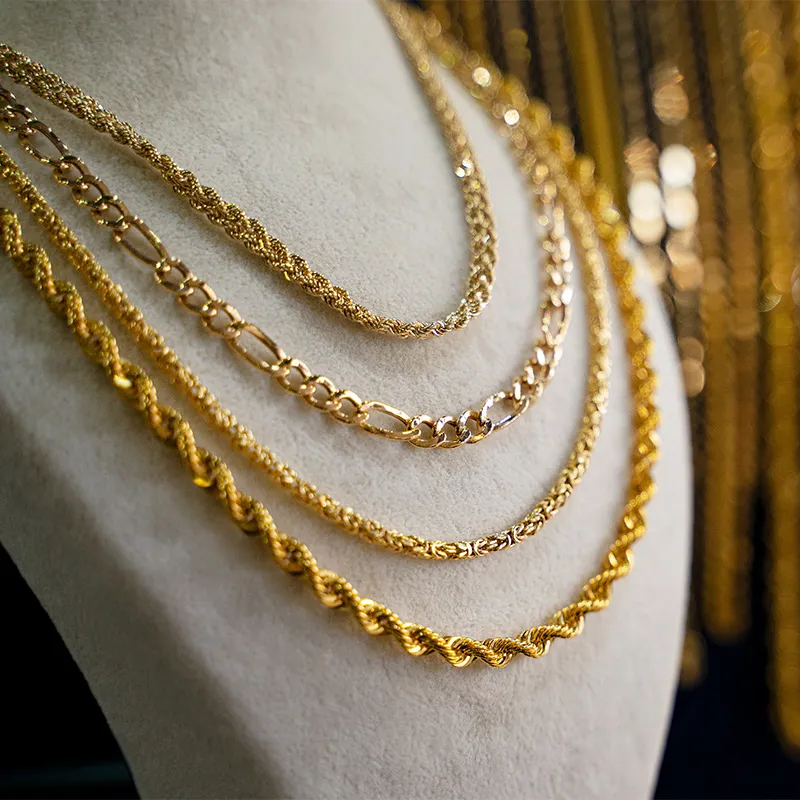 Gold necklaces displayed on a bust. Click to learn more about Italian gold jewelry.
