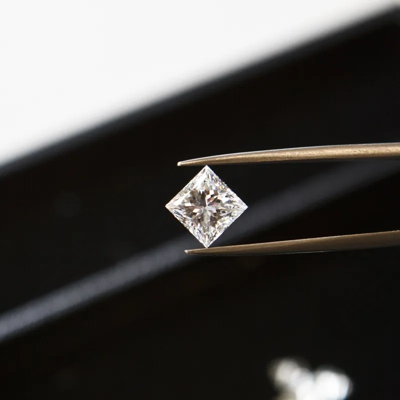 Diamond being examined with tweezers