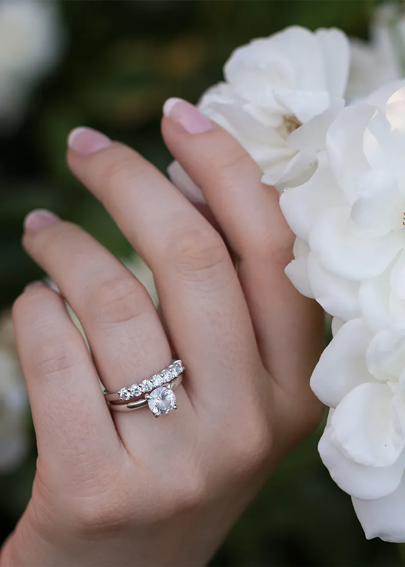 Diamond engagement ring with white flowers
