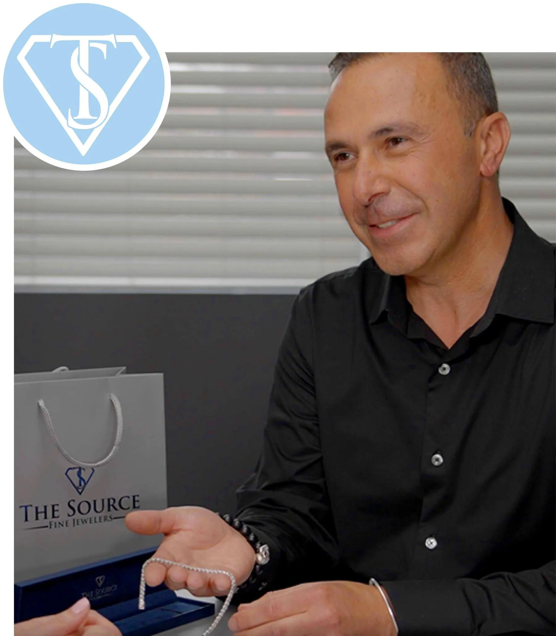 John Simonian, president of The Source Fine Jewelers showing a diamond tennis bracelet